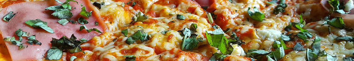 Eating Pizza at Oriole Pizza restaurant in Randallstown, MD.